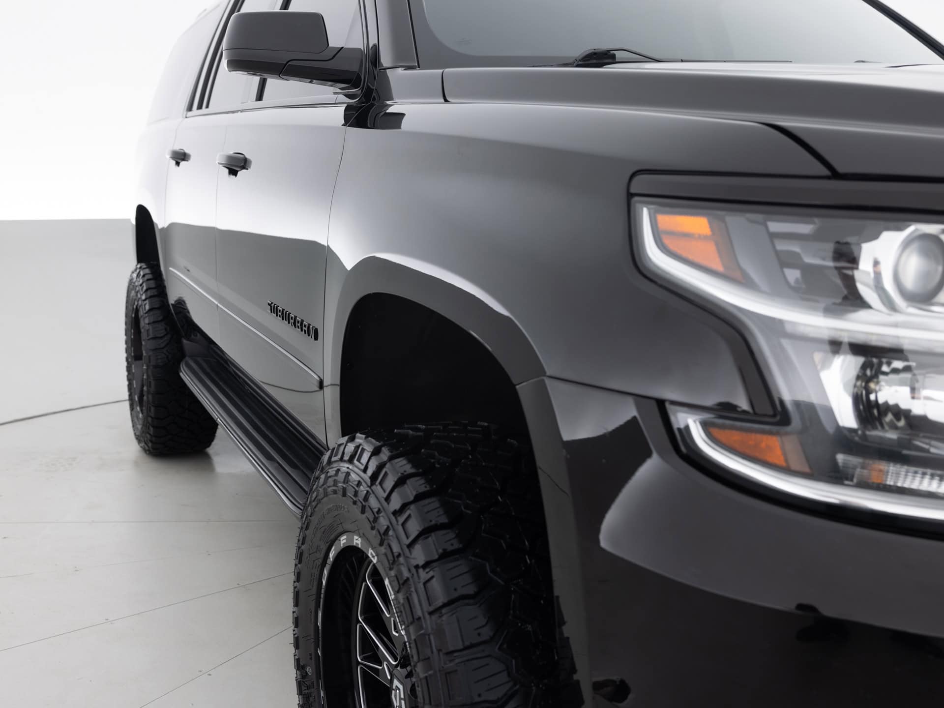 black chevrolet suburban prem 4