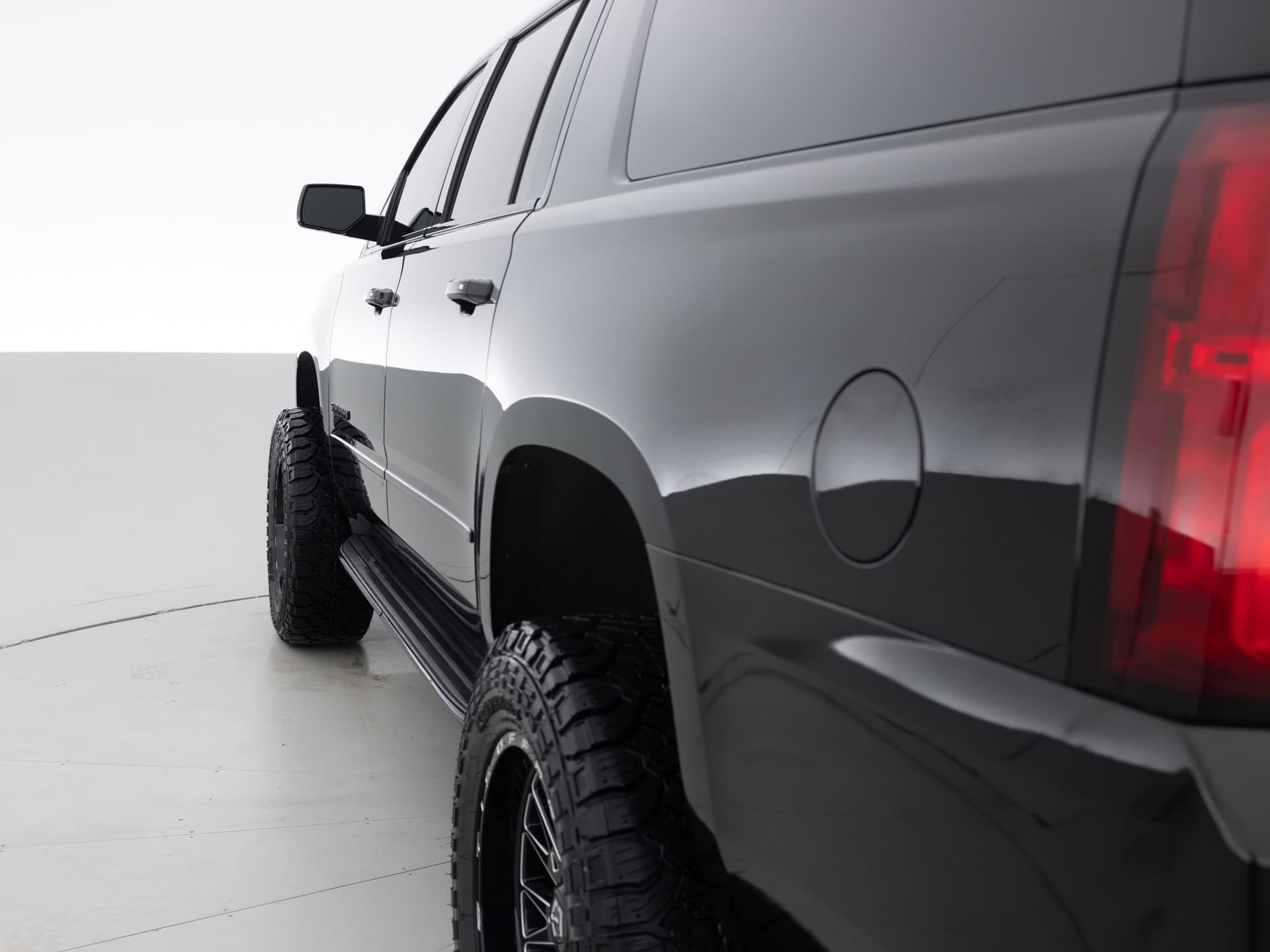 black chevrolet suburban prem 6