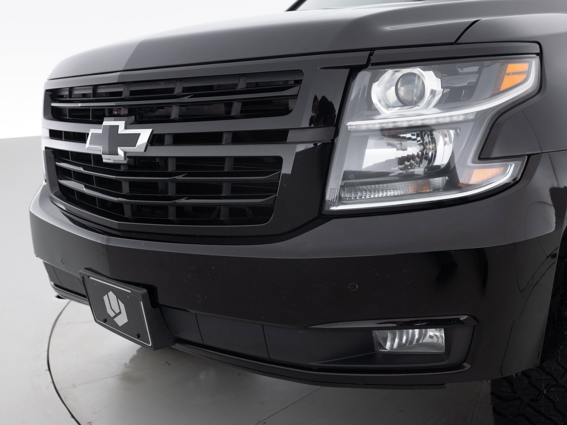 black chevrolet suburban prem 7