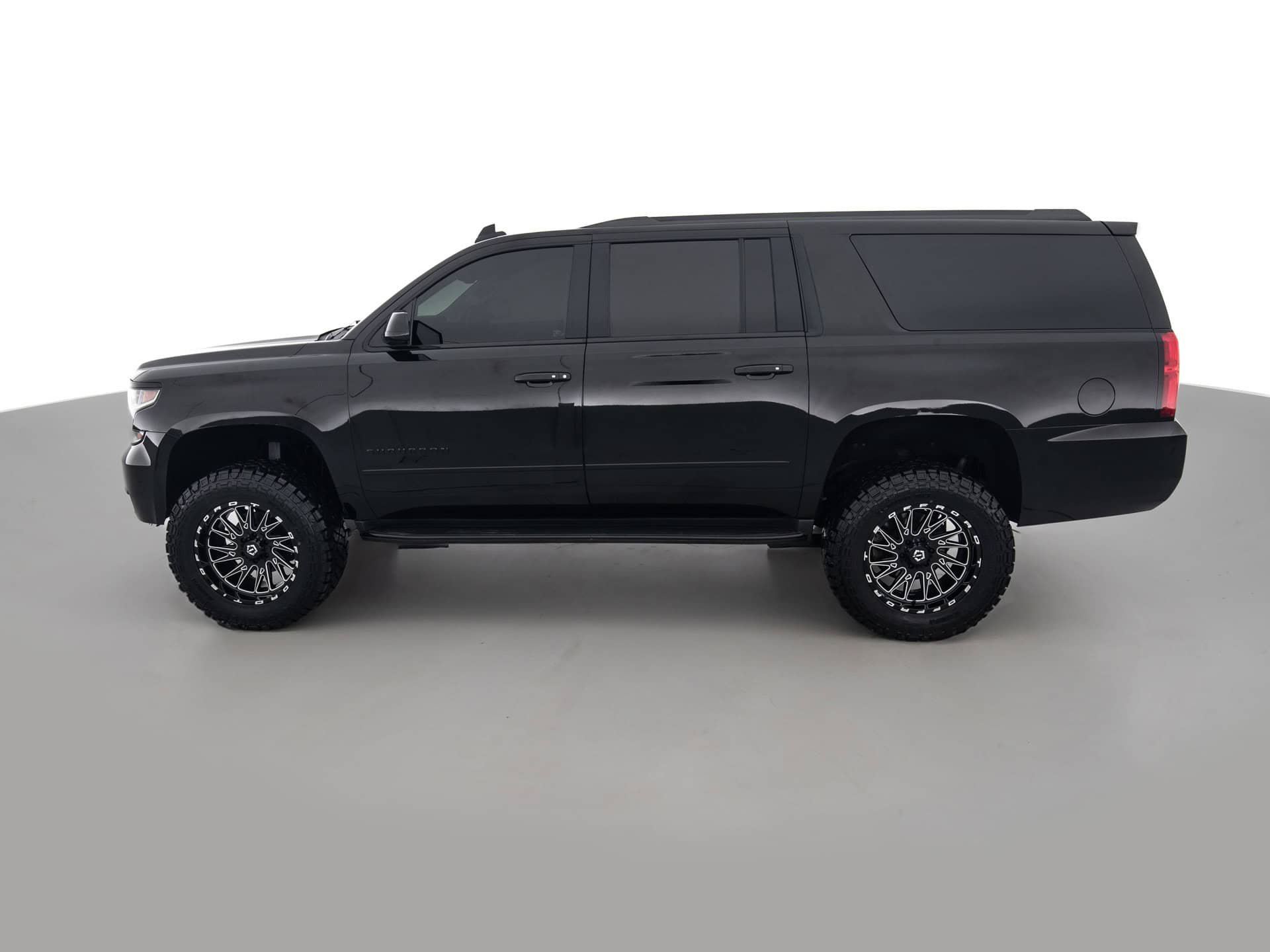 black chevrolet suburban prem 7