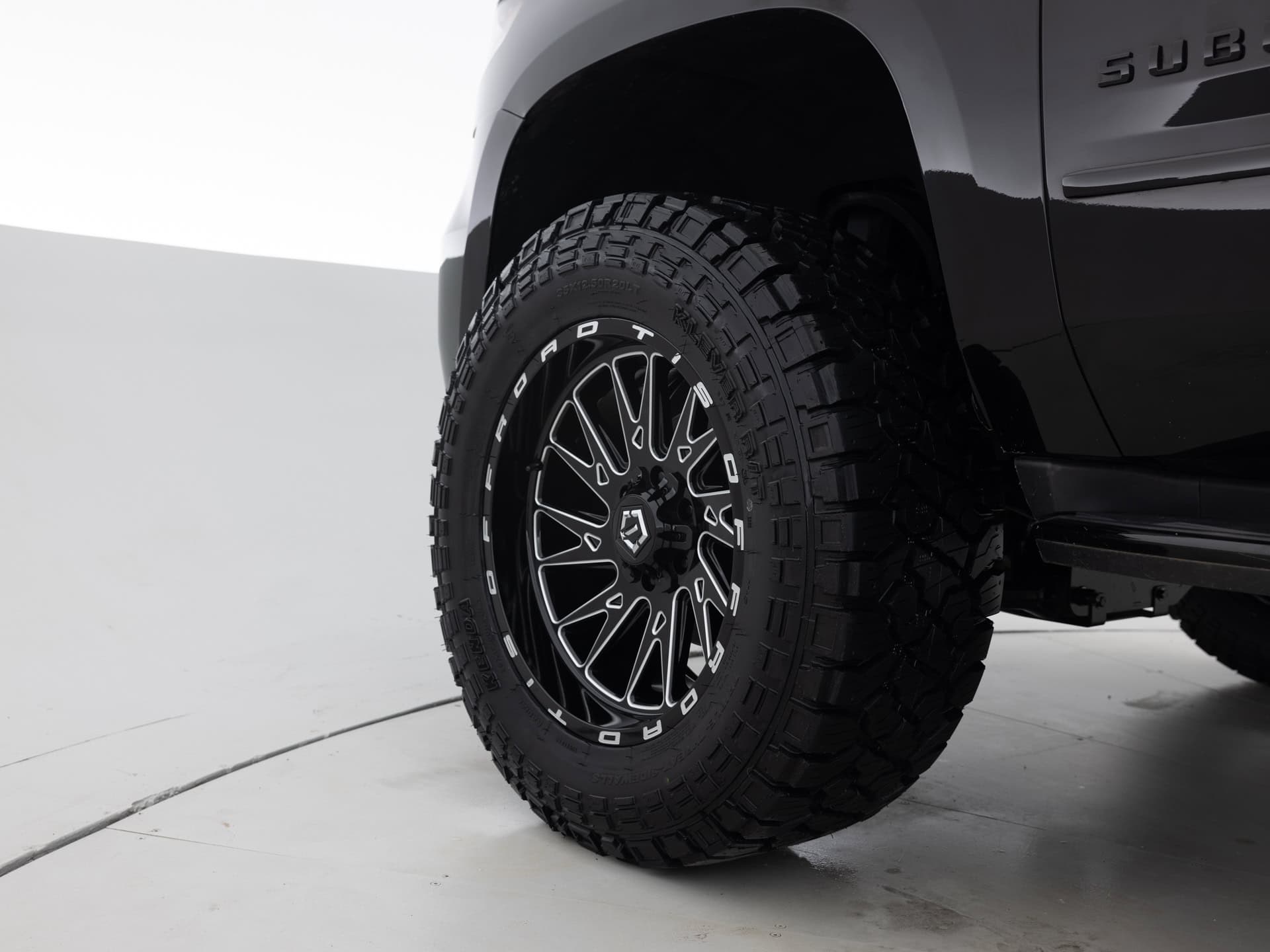 black chevrolet suburban prem 9