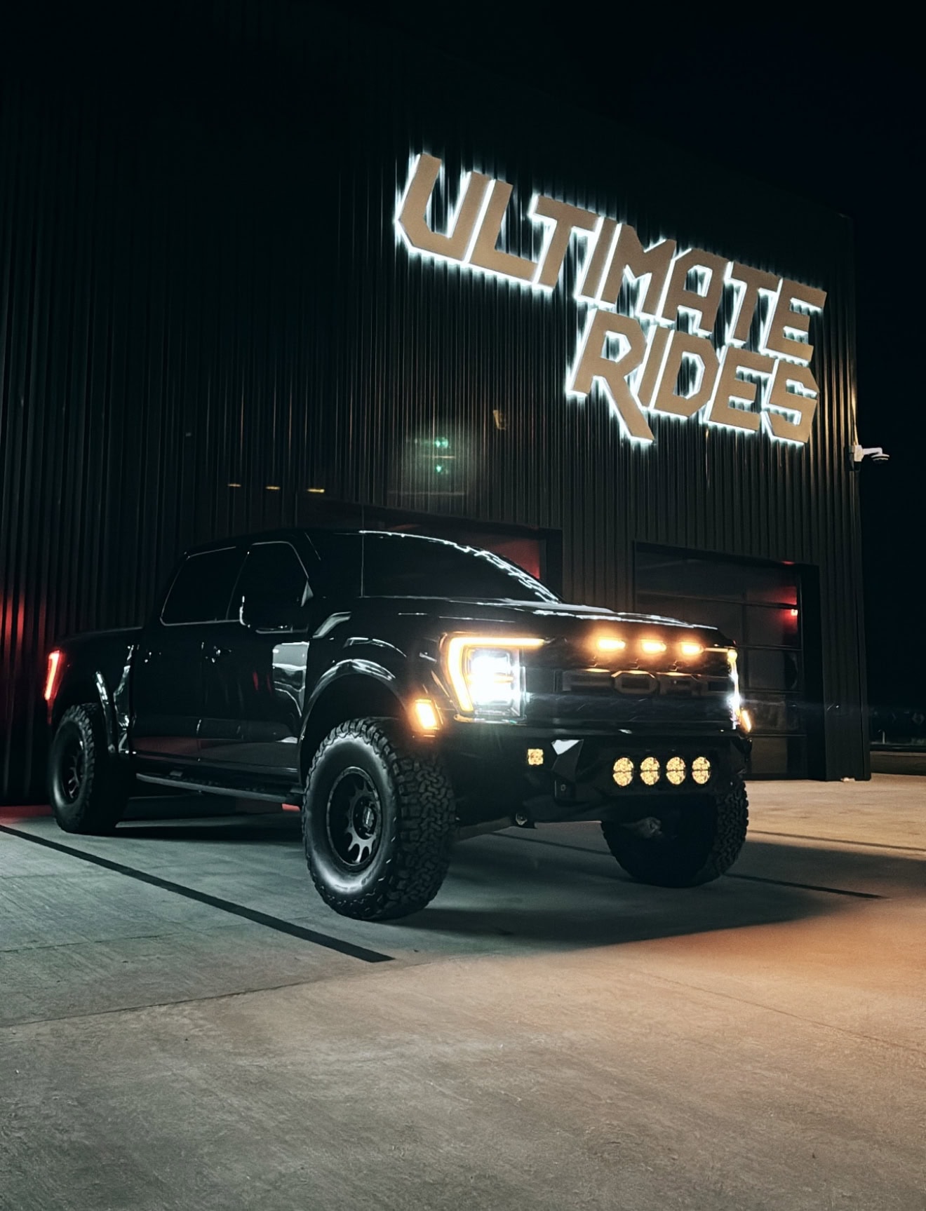 Lifted Truck with the Ultimate Rides logo