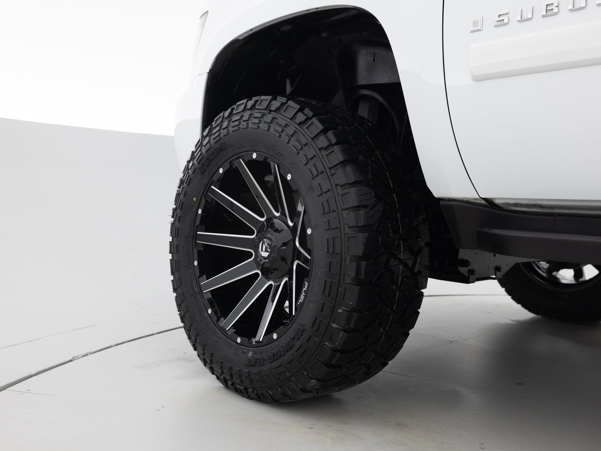 white chevrolet suburban lt 9